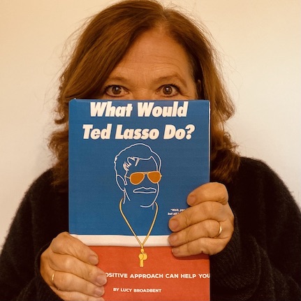 Woman with Ted Lasso Book